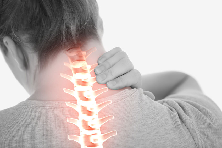 Digital composite of Highlighted spine of woman with neck pain